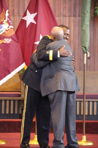 Brigadier General Raymond Scott Dingle and his father, Raymond, embrace after pinning on his new rank.