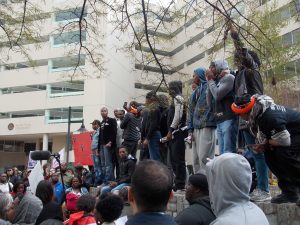 Many more protesters protesting outside of City Hall.