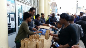 Volunteers distributing food and beverages.