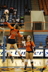 Sophomore Michaela Collins prepares to score as senior Carmen Fernandez looks on. Photo by Benjamin McKnight III