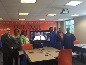 Faculty members in the School of Global Journalism and Communications celebrate the opening of the Innovative and Collaboration Center. Photo by Ahjahnae LaQuer