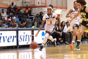 Sophomore guard Breannan Farrar moves the ball up the court against Norfolk State. Photo by Terry Wright.