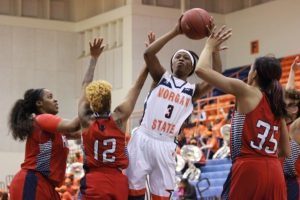 Sophomore forward Tykyrah Williams attempts a shot while contested by Lady Bison. Photo by Terry Wright.