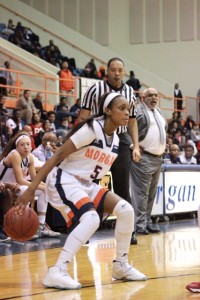 Sophomore guard Breannan Farrar sizes up her opponent. Photo by Terry Wright