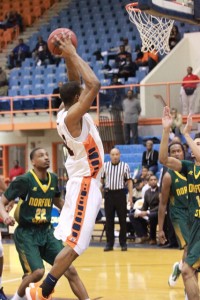 Junior Kyle Thomas goes up for a dunk against Norfolk State University on Wednesday. Photo by Terry Wright