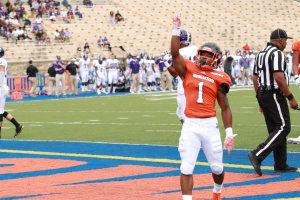 Senior running back Orlando Johnson celebrates after a touchdown against Holy Cross. Photo by Terry Wright.