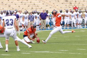 Sophomore kicker Alex Raya converts an extra point against Holy Cross. Photo by Terry Wright.