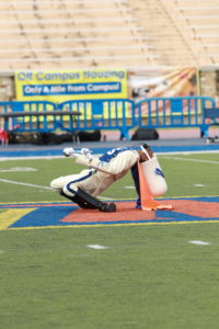 The drum major for the Magnificent Marching Machine begins the halftime show against Holy Cross. Photo by Terry Wright.