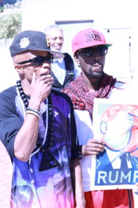 PFK Boom, left, and a fellow activist demonstrate outside of the Baltimore Convention Center. Photo by Terry Wright