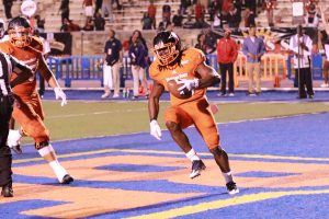 Sophomore running back Eric Harrell celebrates after scoring the go-ahead touchdown in the 4th quarter. Photo by Terry Wright.