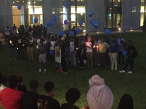 Brothers from Morgan State's S.M.O.O.T.H. (Strong Men Overcoming Obstacles Through Hard Work) honoring Marcus Edwards. Photo credit Devon Ashby