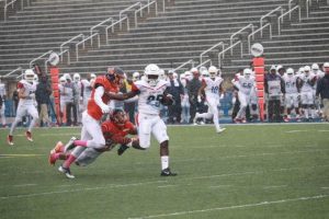 Morgan State defenders attempt to tackle a Delaware State player in Saturday's home contest. Photo by Terry Wright.