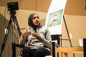 Olympic fencer Ibtihaj Muhammad answers a question from Tuesday's symposium. Photo by Reginald Thomas II.