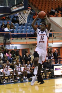 Junior Alex Ennis rises up for a dunk in Tuesday's loss to High Point. Photo by Terry Wright.