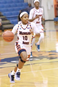 Freshman D'Jhai Patterson-Ricks drives down the court in a win against Washington Adventist University. Photo by Terry Wright.