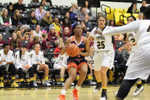 Jihayah Chavis avoids a double-team against UMBC. Photo by Benjamin McKnight III