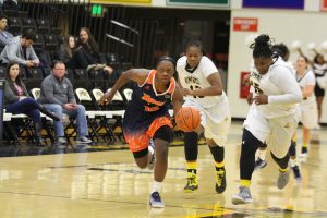 Jayde Duncan drives down the court following a steal against UMBC. Photo by Benjamin McKnight III.