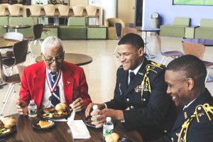 From left to right, Retired Col. Charles McGee, Reginald Rogers, and Charles Muondi at the Tuskegee Airman Symposium luncheon. Photo by Maliik Obee.