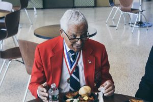 Retired Col. Charles McGee listening to cadets during the Tuskegee Airman Symposium luncheon. Photo by Maliik Obee.