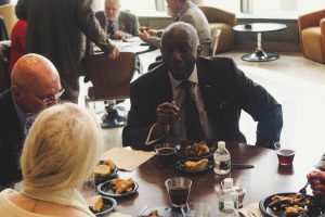 Retired Major General Kip Ward, a Morgan State University alumnus, speaks with guests at the Tuskegee Airman Symposium. Photo by Maliik Obee.