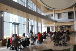 Attendees of the Tuskegee Airman Symposium eating lunch in the Earl G. Graves School of Business. Photo by Maliik Obee.